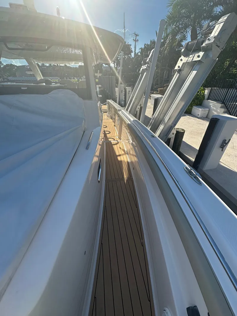 Slide: The Image of 2018 Pursuit 408S boat with sleek deck and modern design. - 18