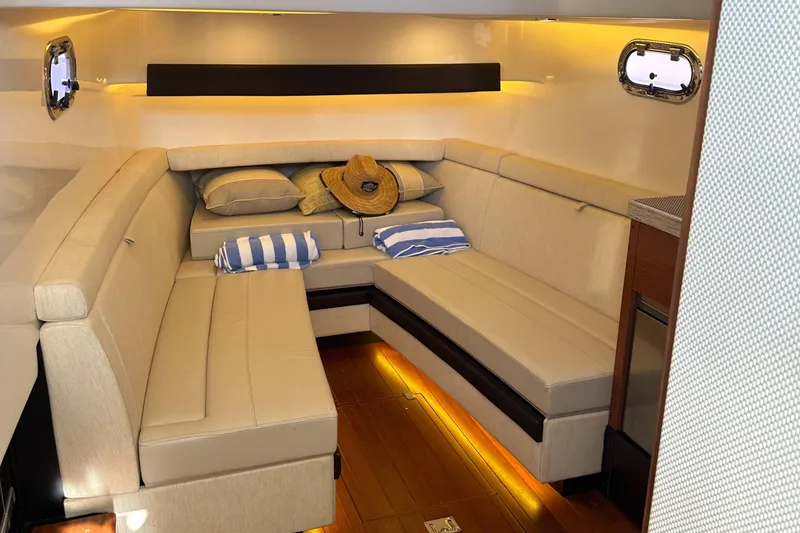 Slide: The Image of Luxurious interior of 2018 Pursuit 408S boat with cozy seating and ambient lighting. - 20