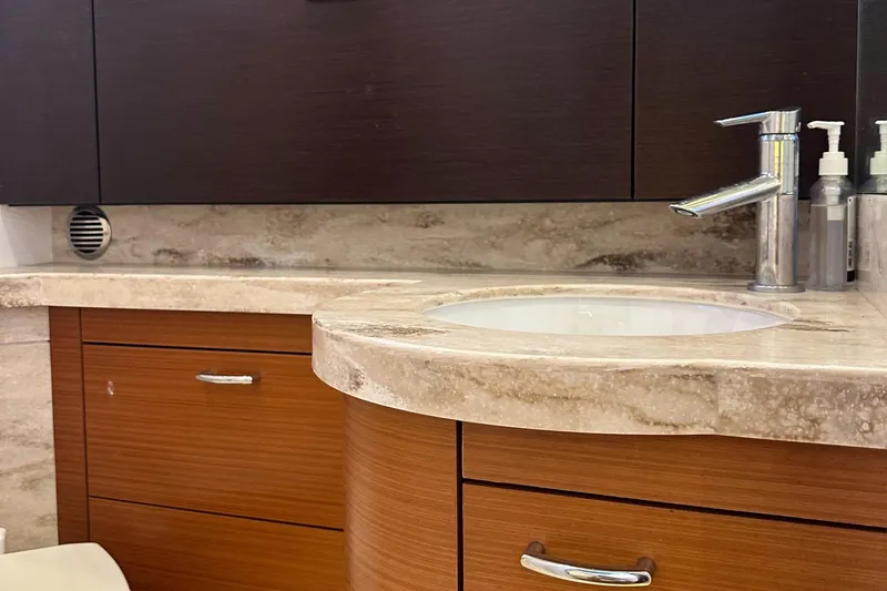 Slide: The Image of Luxurious bathroom vanity in 2018 Pursuit 408S boat with marble countertop and modern faucet. - 21