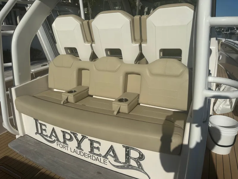 Slide: The Image of 2018 Pursuit 408S boat seating with "Leap Year" Fort Lauderdale branding. - 9