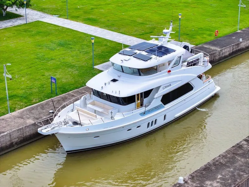 Slide: The Image of Luxurious 2027 Selene 64 yacht docked in a serene canal setting. - 18