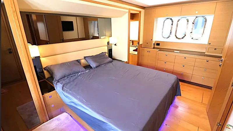 Slide: The Image of Luxurious bedroom interior on 2027 Selene 64 yacht, featuring elegant wood cabinetry and modern design. - 4