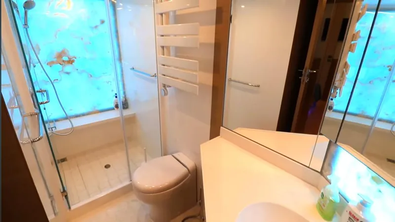 Slide: The Image of Modern bathroom in Selene 64 yacht, 2027 model, featuring shower, toilet, and sleek vanity. - 5