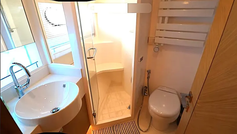 Slide: The Image of Modern yacht bathroom with sink, shower, and toilet in Selene 64, 2027 model. - 7