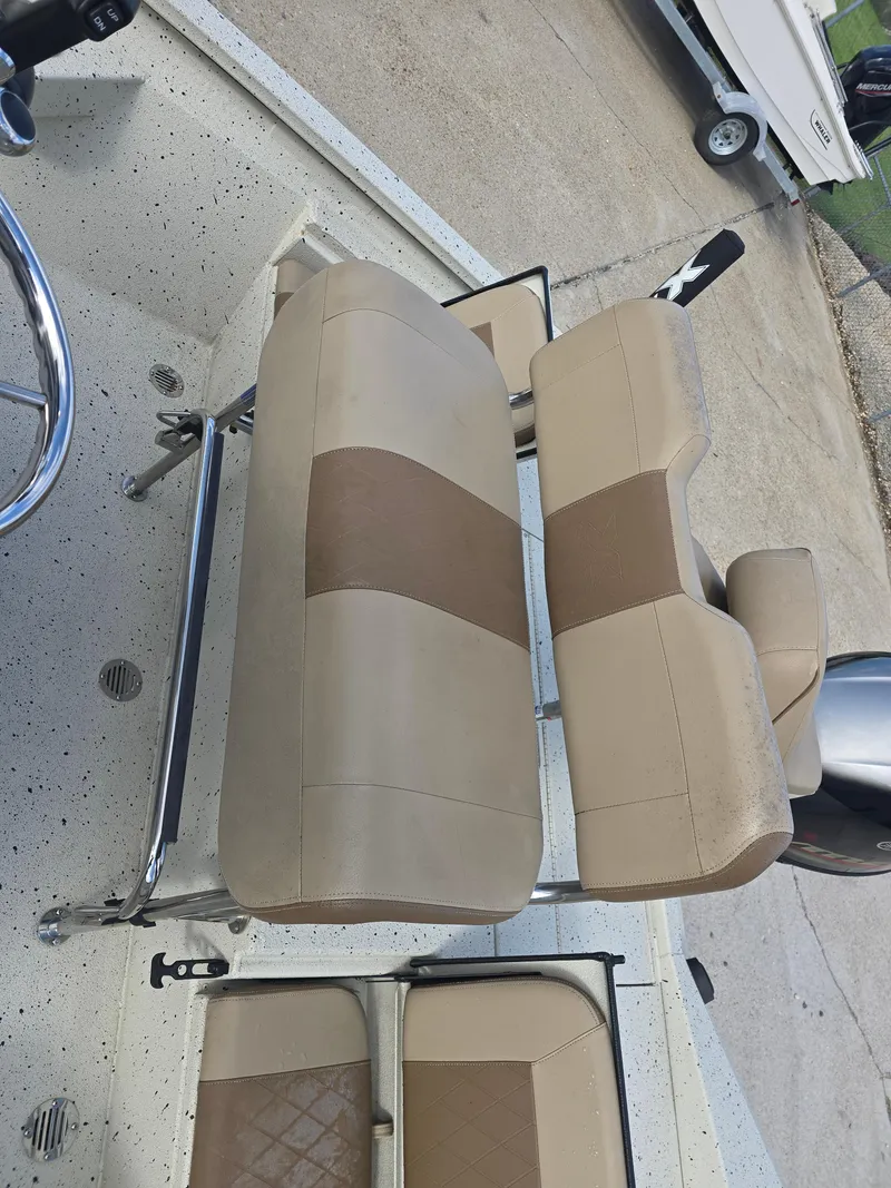 Slide: The Image of 2020 Xpress H20B boat interior with beige and brown seating arrangement. - 15
