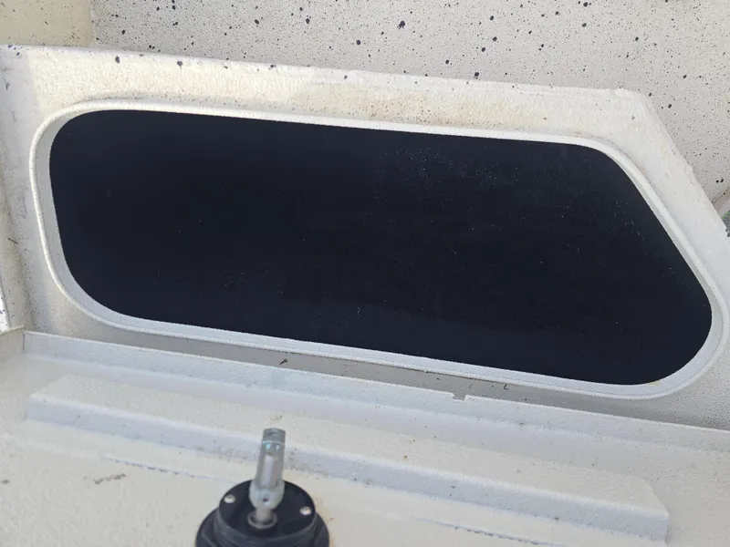 Slide: The Image of Open storage compartment on a 2020 Xpress H20B boat. - 19