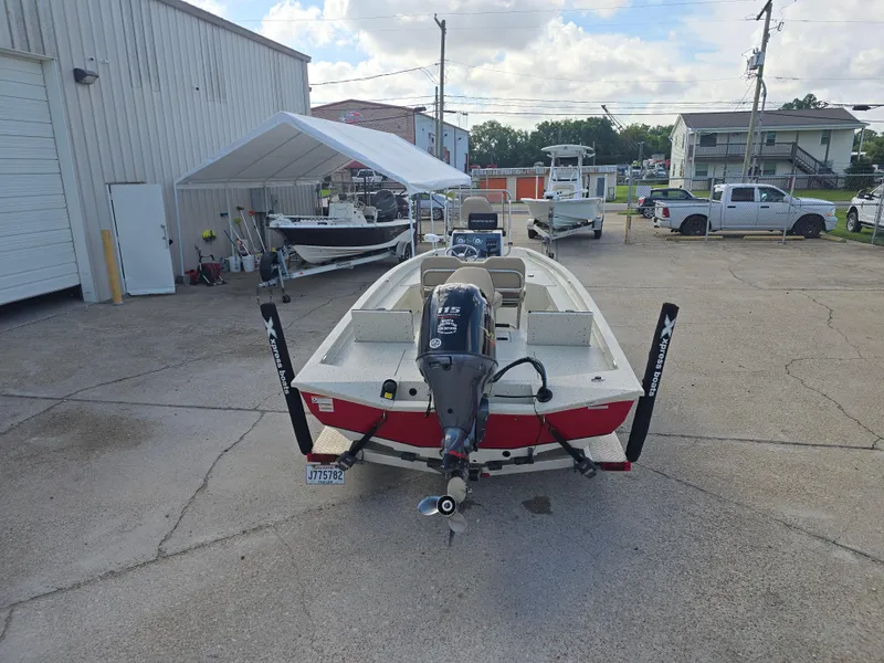 Slide: The Image of 2020 Xpress H20B boat with Yamaha 115 engine in a parking lot. - 9