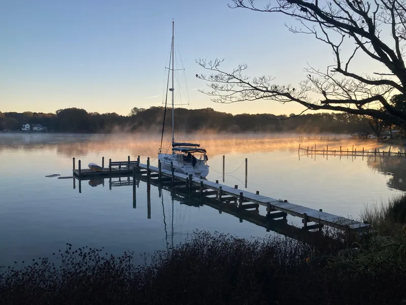 The Image of Sailboat docked at sunrise, misty lake view, Hunter 410, 2002 model. - 1