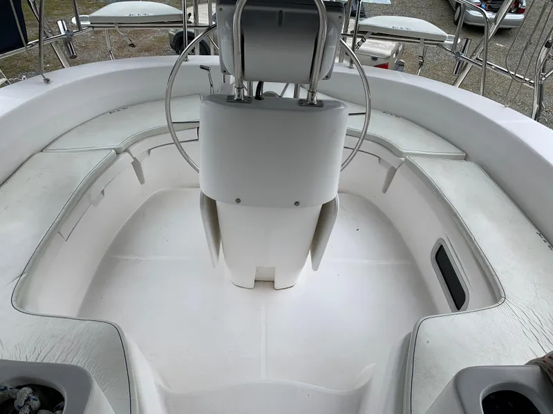 Slide: The Image of Cockpit of 2002 Hunter 410 sailboat with steering wheel and seating. - 24