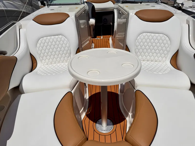Slide: The Image of Luxury seating on a 2005 Monterey 298SS Super Sport boat with a central table. - 11