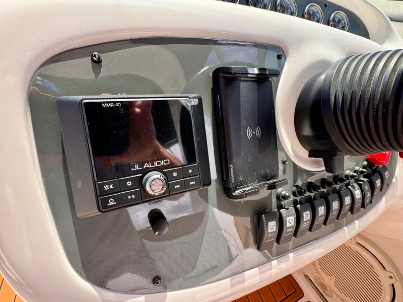Slide: The Image of Control panel of a 2005 Monterey 298SS Super Sport boat with JL Audio system. - 13