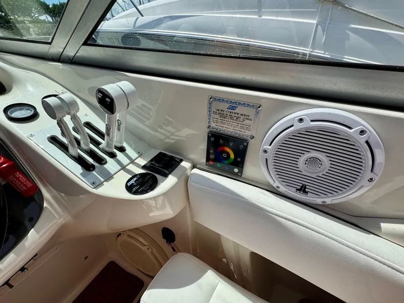 Slide: The Image of Interior of 2005 Monterey 298SS Super Sport boat with controls and speaker. - 14