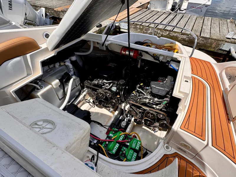 Slide: The Image of Open engine compartment of a 2005 Monterey 298SS Super Sport boat at a dock. - 22