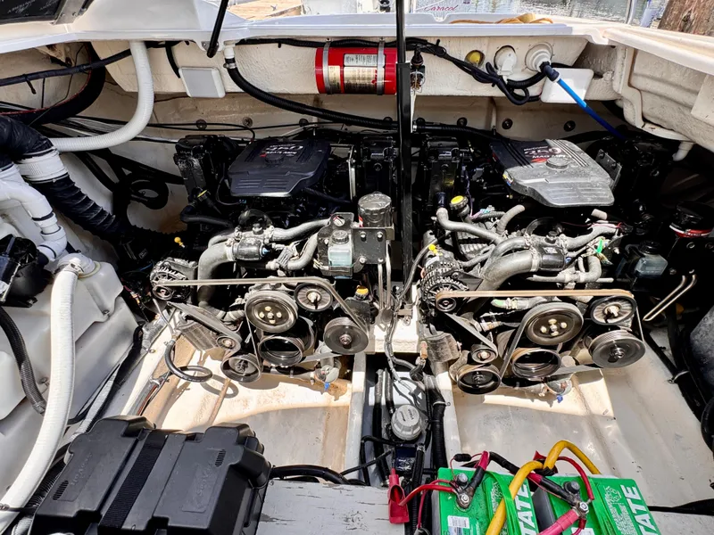 Slide: The Image of Engine compartment of a 2005 Monterey 298SS Super Sport boat, showcasing dual engines and components. - 23