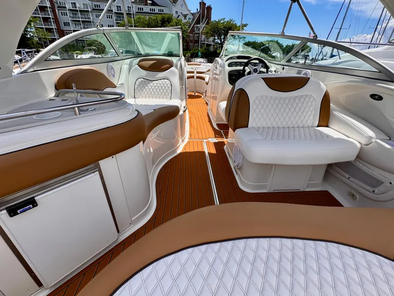 Slide: The Image of Luxurious interior of a 2005 Monterey 298SS Super Sport boat with elegant seating and wood flooring. - 5