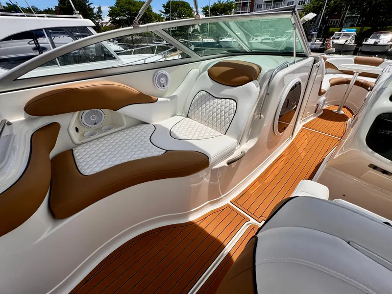 Slide: The Image of Luxurious interior of a 2005 Monterey 298SS Super Sport boat with elegant seating and wood flooring. - 7