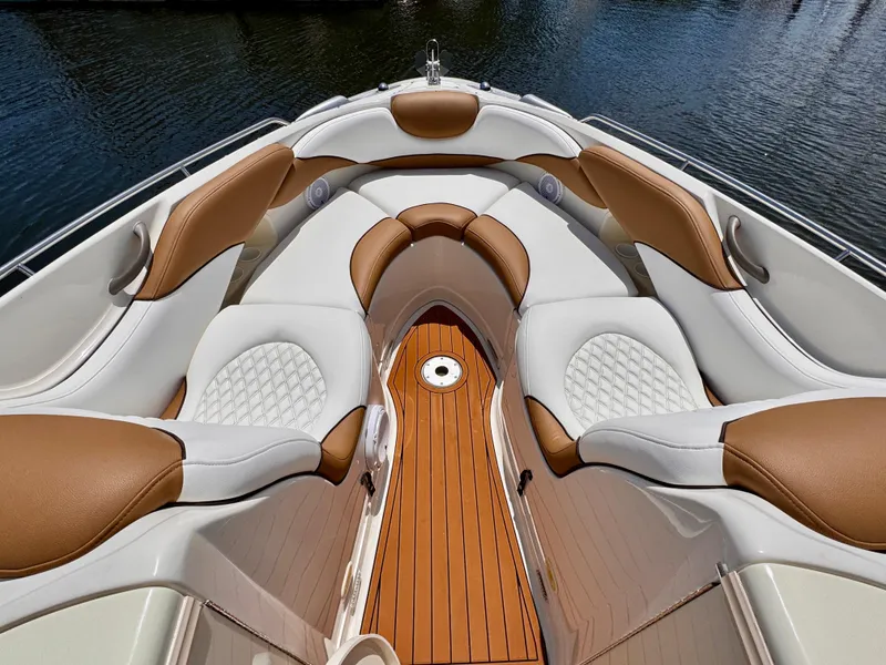 Slide: The Image of 2005 Monterey 298SS Super Sport boat interior with luxurious seating and wooden deck. - 8