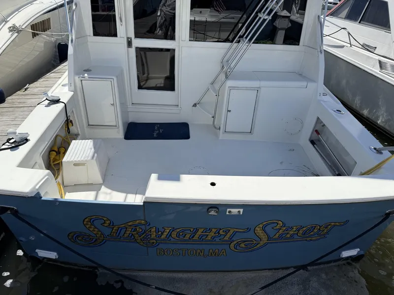 Slide: The Image of 1988 Ocean Yachts 35 Flybridge boat docked, named "Straight Shot," Boston, MA. - 3