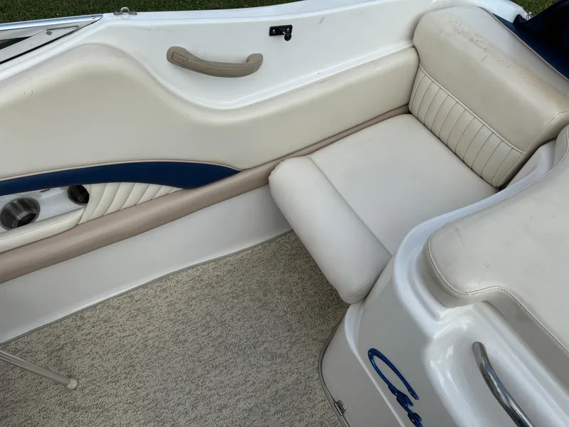 Slide: The Image of 1999 Chris-Craft 200 Bowrider SS interior with beige and blue seating. - 6