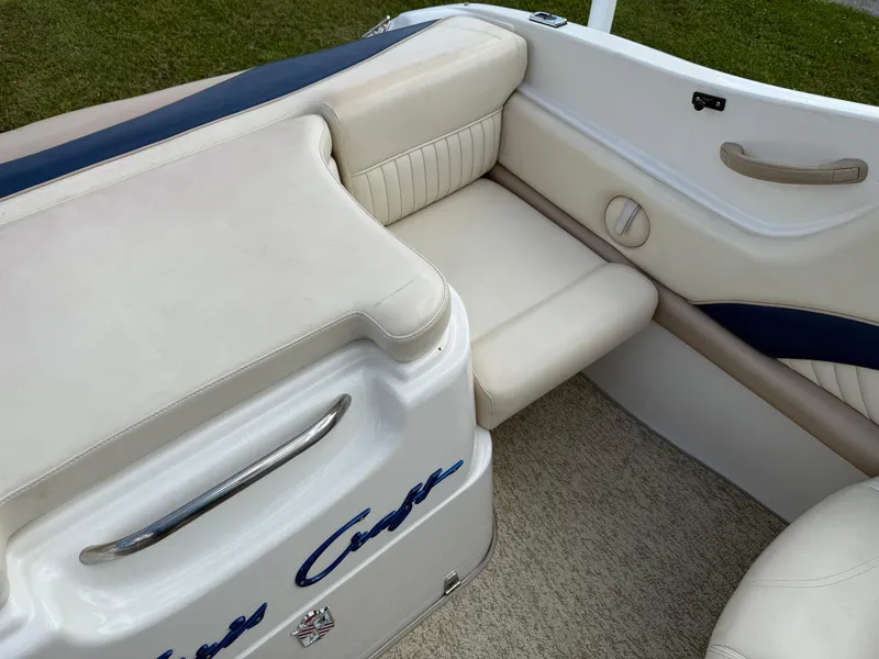 Slide: The Image of 1999 Chris-Craft 200 Bowrider SS interior with cream and blue seating. - 7
