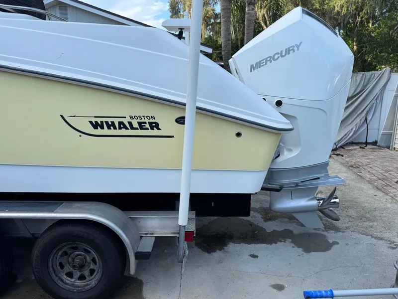Slide: The Image of 2005 Boston Whaler 270 Outrage boat with Mercury engine on trailer. - 5
