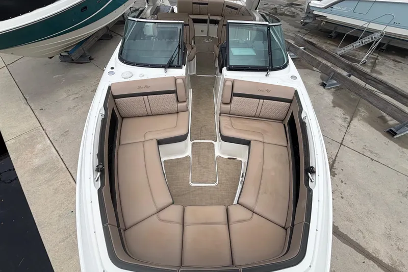 Slide: The Image of 2018 Sea Ray SLX 310 Outboard boat with spacious seating and elegant design. - 10