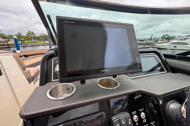 Slide: The Image of Dashboard of 2018 Sea Ray SLX 310 Outboard with Garmin GPS display. - 18