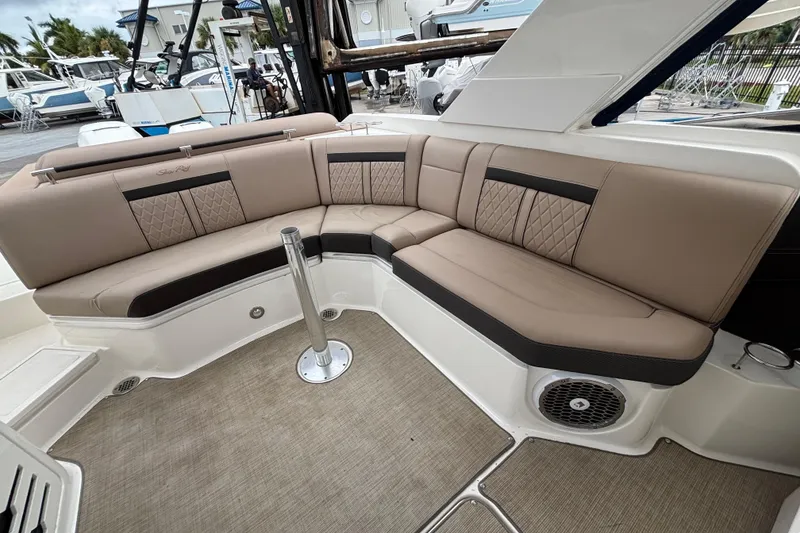 Slide: The Image of Luxurious seating on 2018 Sea Ray SLX 310 Outboard boat, featuring elegant upholstery and spacious design. - 30