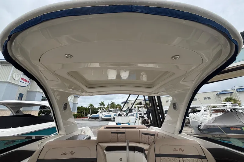 Slide: The Image of 2018 Sea Ray SLX 310 Outboard boat interior with sleek design and comfortable seating. - 32