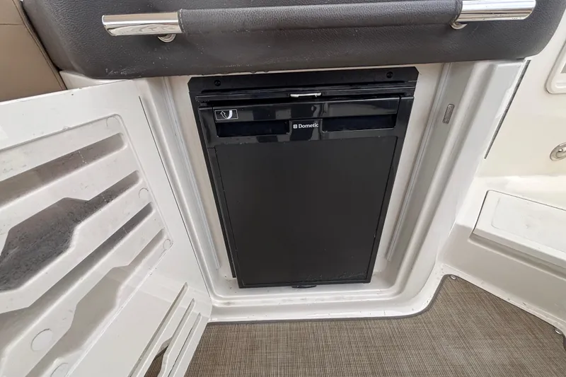 Slide: The Image of Dometic refrigerator in 2018 Sea Ray SLX 310 Outboard boat interior. - 36