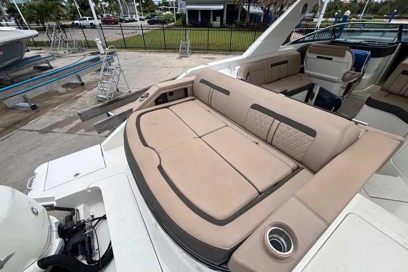 Slide: The Image of 2018 Sea Ray SLX 310 Outboard boat with luxurious seating and modern design. - 40