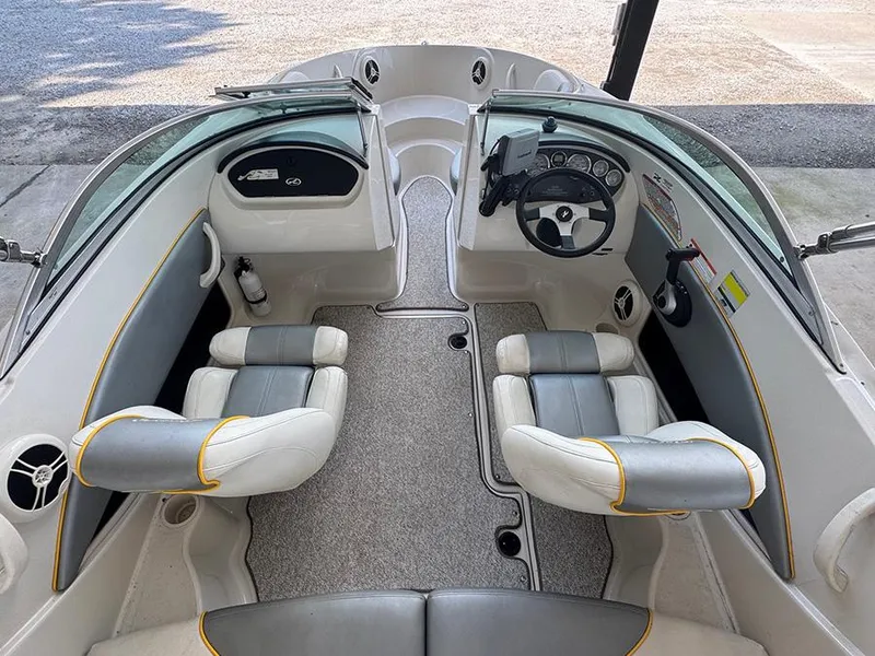 Slide: The Image of 2008 Sea Ray 185 Sport boat interior with dual seats and steering console. - 12