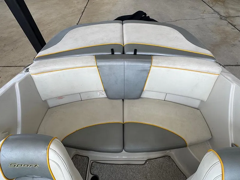 Slide: The Image of 2008 Sea Ray 185 Sport boat interior with gray and white seating. - 13