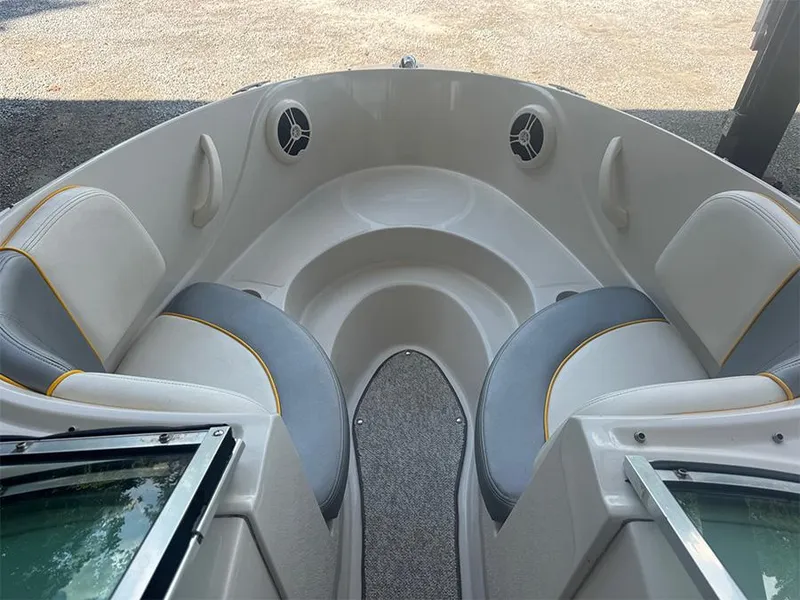 Slide: The Image of 2008 Sea Ray 185 Sport boat interior with gray and white seating, yellow accents. - 4