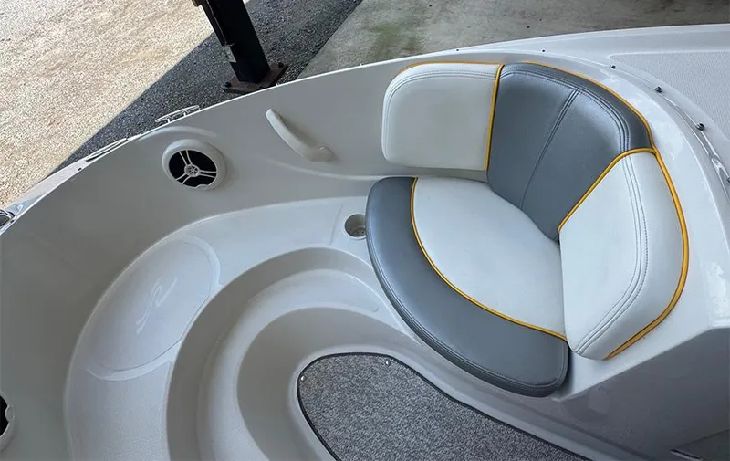 Slide: The Image of 2008 Sea Ray 185 Sport boat interior with cushioned seating and speaker. - 5