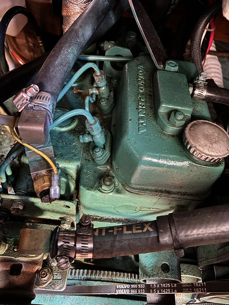 Slide: The Image of Engine compartment of a 1981 Sabre 30 sailboat, featuring Volvo Penta components. - 12