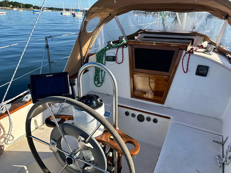 Slide: The Image of Cockpit of 1981 Sabre 30 sailboat with steering wheel and navigation equipment. - 5