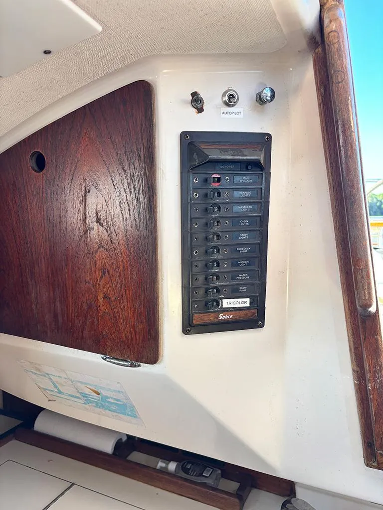 Slide: The Image of Electrical panel of a 1981 Sabre 30 sailboat with wooden accents. - 6