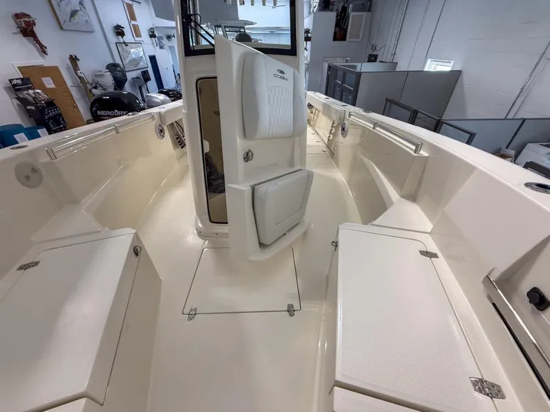Slide: The Image of 2025 Cobia 265 Open Center Console boat interior with seating and storage compartments. - 6