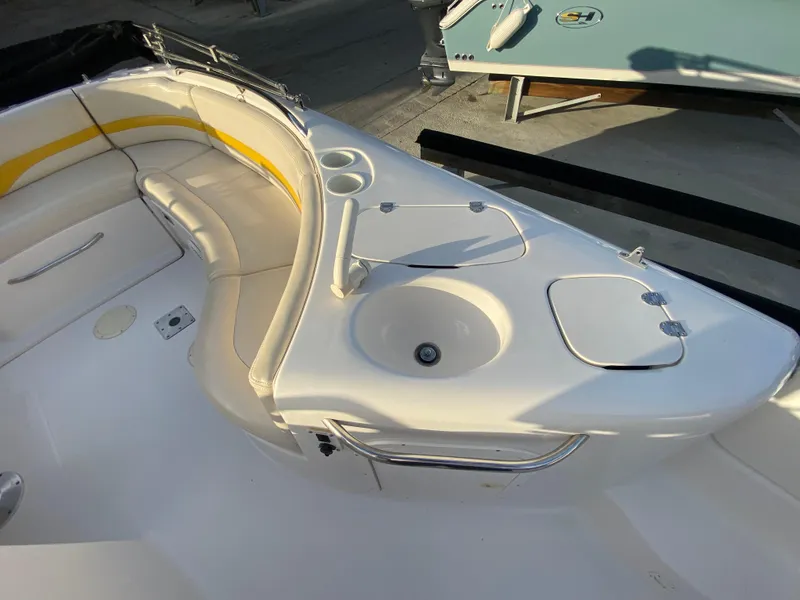 Slide: The Image of 2001 Chaparral Sunesta 232 boat interior with seating and sink area. - 15
