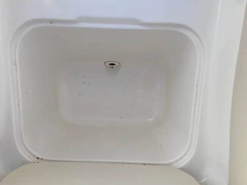 Slide: The Image of Empty storage compartment in a 2001 Chaparral Sunesta 232 boat. - 28