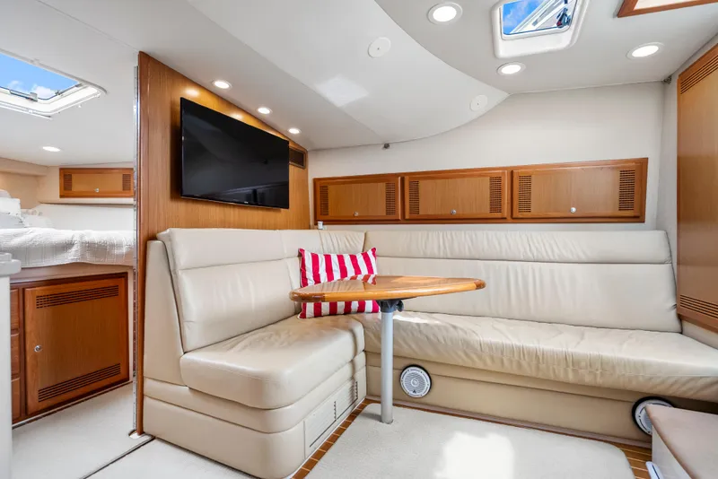 Slide: The Image of Luxurious interior of 2004 Cabo 40 Express yacht with leather seating and modern amenities. - 2