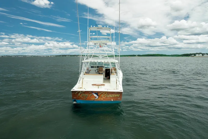 Slide: The Image of 2004 Cabo 40 Express boat on open water under a partly cloudy sky. - 6