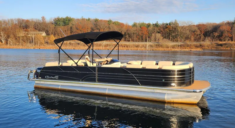 Slide: The Image of 2019 Misty Harbor 2685 Skye SE pontoon boat on a calm lake. - 10