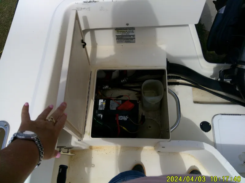 Slide: The Image of Open hatch on 2008 Parker 2120 Sport Cabin showing battery compartment and wiring. - 18