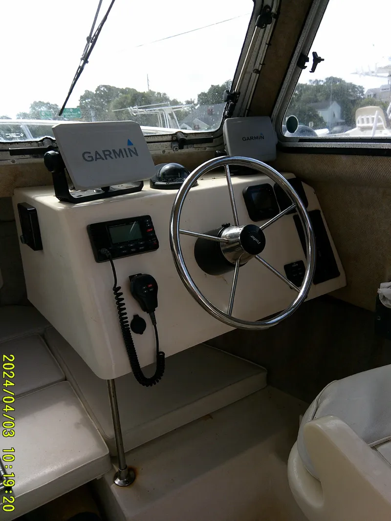 Slide: The Image of 2008 Parker 2120 Sport Cabin helm with Garmin navigation system. - 33