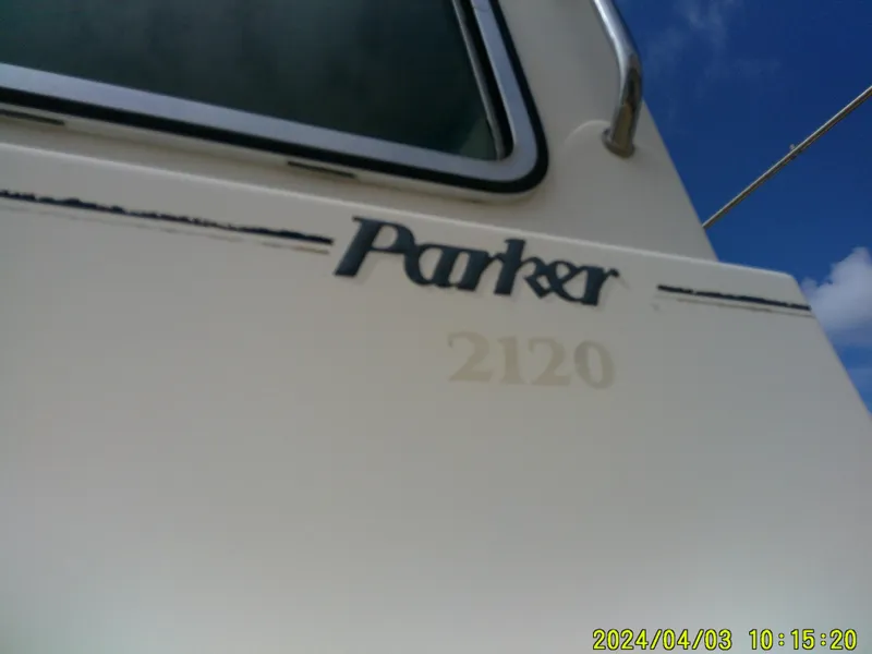 Slide: The Image of Close-up of a 2008 Parker 2120 Sport Cabin boat exterior with logo. - 7