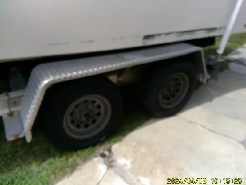 Slide: The Image of Trailer with dual wheels for 2008 Parker 2120 Sport Cabin boat. - 8