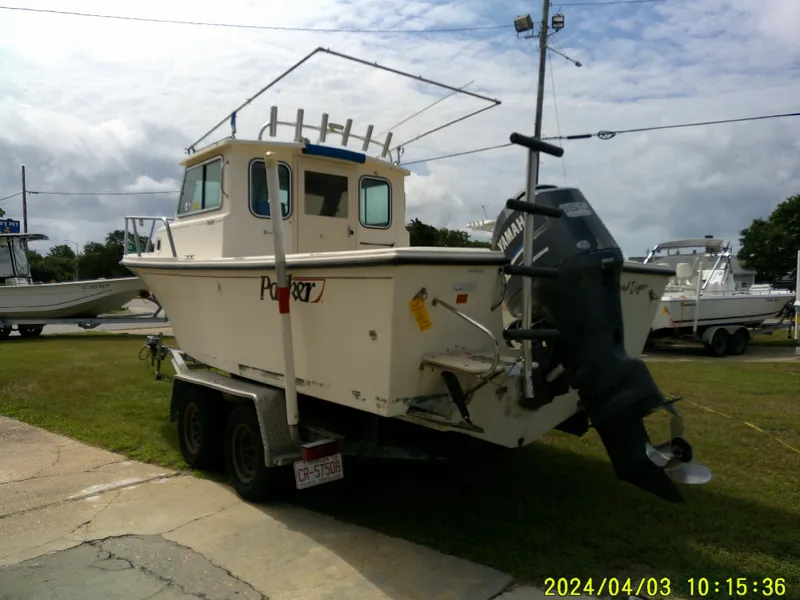 Slide: The Image of 2008 Parker 2120 Sport Cabin boat on trailer with Yamaha outboard motor. - 9