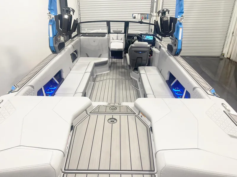 Slide: The Image of 2025 Nautique Super Air Nautique GS24 interior with sleek seating and modern dashboard. - 10